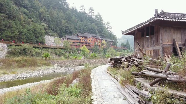 Pan shot of the countryside of rural China in the  Xijiang Qianhu Miao Village.