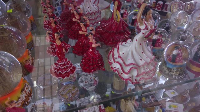 Souvenir figurine of flamenco dancer women in tourist shop window in Spain