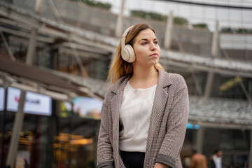 Fototapeta premium Blonde Teenager Listening To Music With Headphones