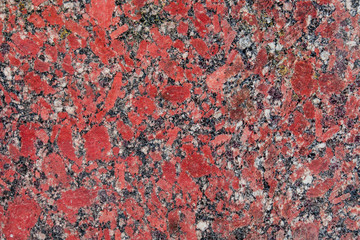 Old stone background from red granite, for advertising construction services