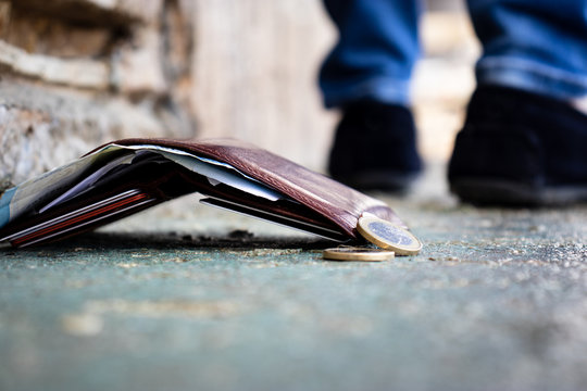 fallen wallet on street with money inside. concept lose wallet