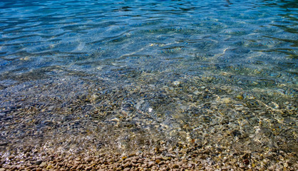 Oludeniz, Turkey. Blue Lagoon. Stones and small pebbles in the transparent sea