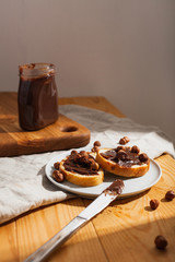 Sandwiches with chocolate paste on the table