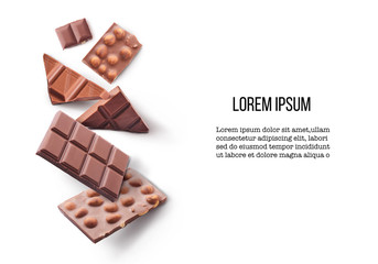 Different types of chocolate pieces falling in the air isolated on white background. Design mockup...