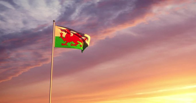 Welsh flag waving represents the country of Wales and Capital Cardiff. For tourism nationality and patriotism - 4k