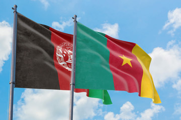 Fototapeta na wymiar Cameroon and Afghanistan flags waving in the wind against white cloudy blue sky together. Diplomacy concept, international relations.