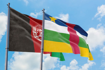 Central African Republic and Afghanistan flags waving in the wind against white cloudy blue sky together. Diplomacy concept, international relations.