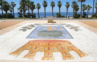 Civitavecchia, Italy.  Colorful pedestrian pavement along beach front . Civitavecchia is a sea port...