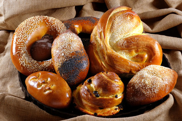 Set with fresh homemade pastries and different toppings. Side view.