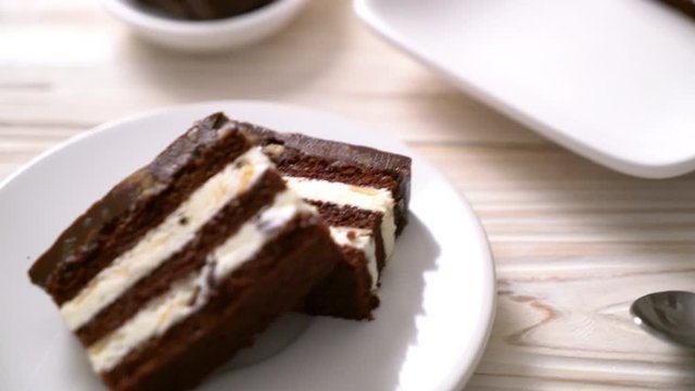 Delicious chocolate cake with almonds on plate