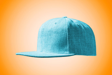 Light blue flat brim baseball cap on orange background