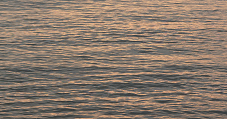 Sunset sunlight ray on the sea surface