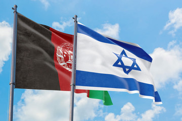 Israel and Afghanistan flags waving in the wind against white cloudy blue sky together. Diplomacy concept, international relations.