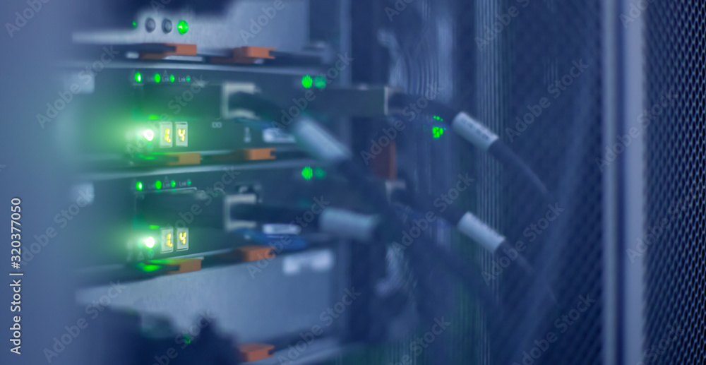 Poster server racks in high tech internet data center room.