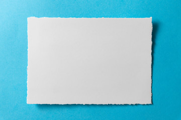 Blank postcard template on a blue background.