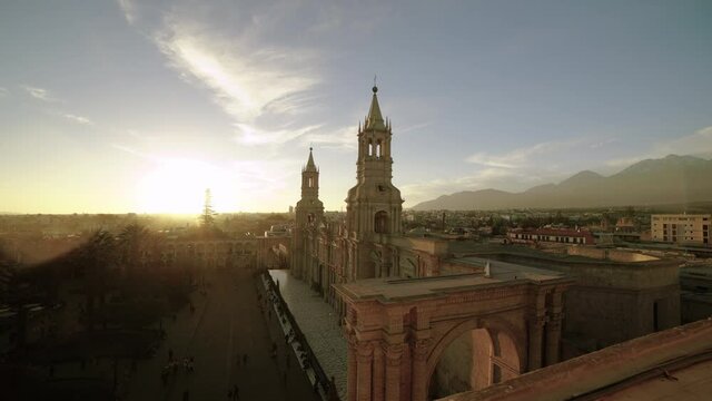 Time-lapse video of Sunset over Arequipa, Peru. Scenic view of Plaza de Armas and Basilica Cathedral with Volc&aacute;n Misti and the Andes Mountains in the background. Long 30 seconds version.