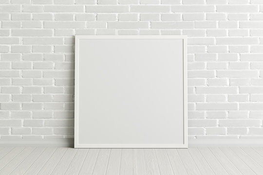 Blank square poster frame mock up standing on white floor next to white brick wall. Clipping path around poster. 3d illustration