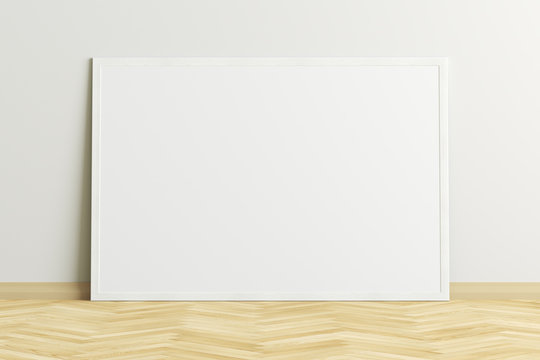 Blank horizontal poster frame mock up standing on light herringbone parquet floor next to white wall. Clipping path around poster. 3d illustration