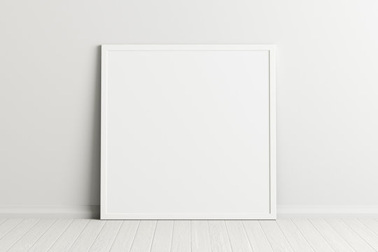 Blank square poster frame mock up standing on white floor next to white wall. Clipping path around poster. 3d illustration