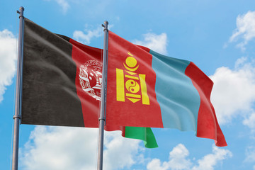 Mongolia and Afghanistan flags waving in the wind against white cloudy blue sky together. Diplomacy concept, international relations.