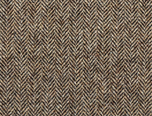 Beige woolen fabric striped zigzag. Classic Herringbone tweed, Wool Background Texture. Coat close-up. Expensive men's suit fabric. High resolution - obrazy, fototapety, plakaty
