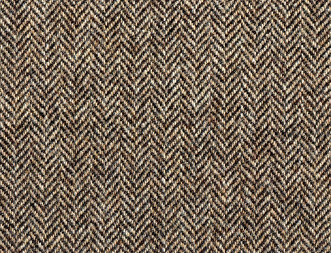 Beige woolen fabric striped zigzag. Classic Herringbone tweed, Wool Background Texture. Coat close-up. Expensive men's suit fabric. High resolution
