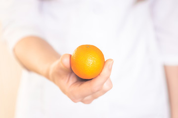 concept doctor prescribes vitamins. the doctor gives the fruit to the patient.