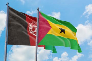Sao Tome And Principe and Afghanistan flags waving in the wind against white cloudy blue sky together. Diplomacy concept, international relations.