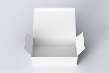 Blank white wide flat box with opened hinged flap lid on white background. Clipping path around box mock up. 3d illustration