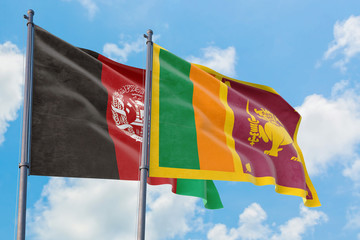 Sri Lanka and Afghanistan flags waving in the wind against white cloudy blue sky together. Diplomacy concept, international relations.