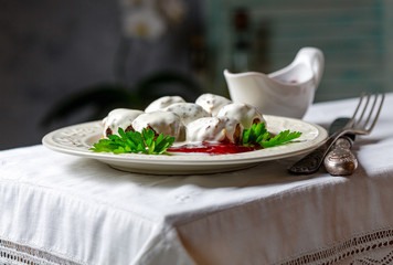 Meatballs with white creamy sauce.