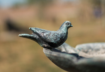 Small sculpture of a bird in the garden