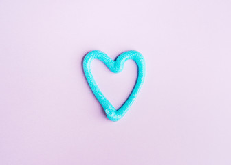 Heart shaped toothpaste line on pink