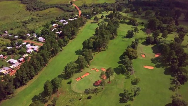 Golf club Tacuru, Misiones, Argentina, South America. Drone ar view. Panoramic of green and fairways, cinematic, reveal golf club.