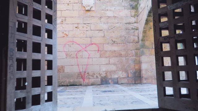 A steady view of an old antique door of the palace of Catholic architecture art at the Palma Cathedral Roman Catholic Diocese of Majorca, Spain.