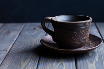 cup with coffee on wooden background