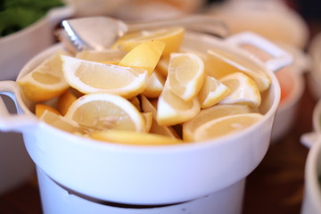 sliced lemons in a bowl