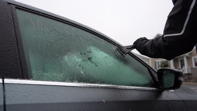 Scratching ice on car windows