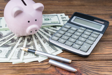 Piggy pig, money dollars calculator. Business concept idea, money finance, accumulation calculation