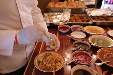 chief is pouring sauce