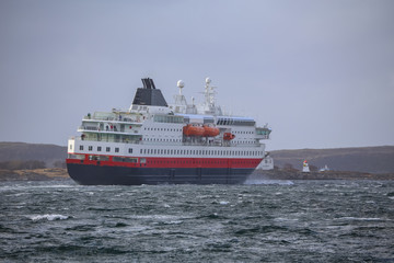 The coast passenger ship in strong wind on arrival Br&oslash;nn&oslash;ysund, Nodland county