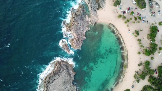 Birds Eye Aerial View of Majestic Mar Chiquita Beach Lagoon in Mushroom Shape, Puerto Rico