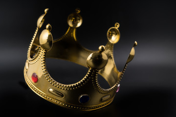 Golden crown on a black background