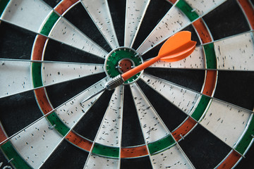 Darts arrows in the target center background