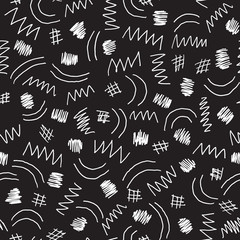 Hand drawn zig zag line seamless pattern. Scratch white lines on a black background.