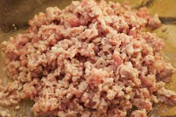 Cooking chicken mince in pot 