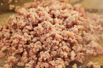 Cooking chicken mince in pot 