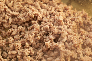 Cooking chicken mince in pot 