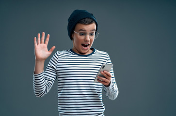 Fashionable boy on a gray background