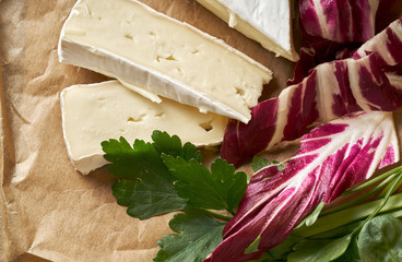 White delicious homemade camambert cheese on a paper